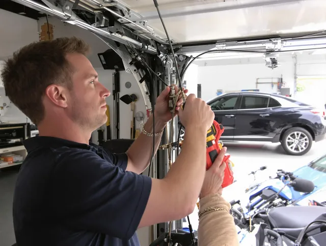Bell Garage Door Repair safety certified technician performing cable replacement in Bell