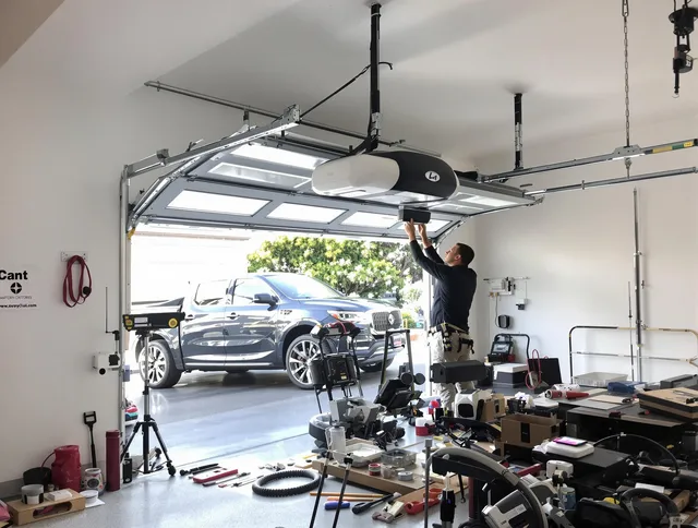 Bell Garage Door Repair specialist installing smart garage door opener system in Bell home