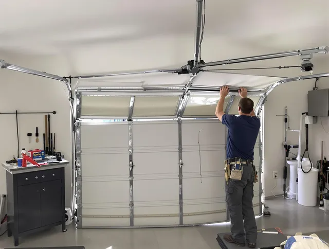 Bell Garage Door Repair specialist performing precise section replacement on Bell garage door